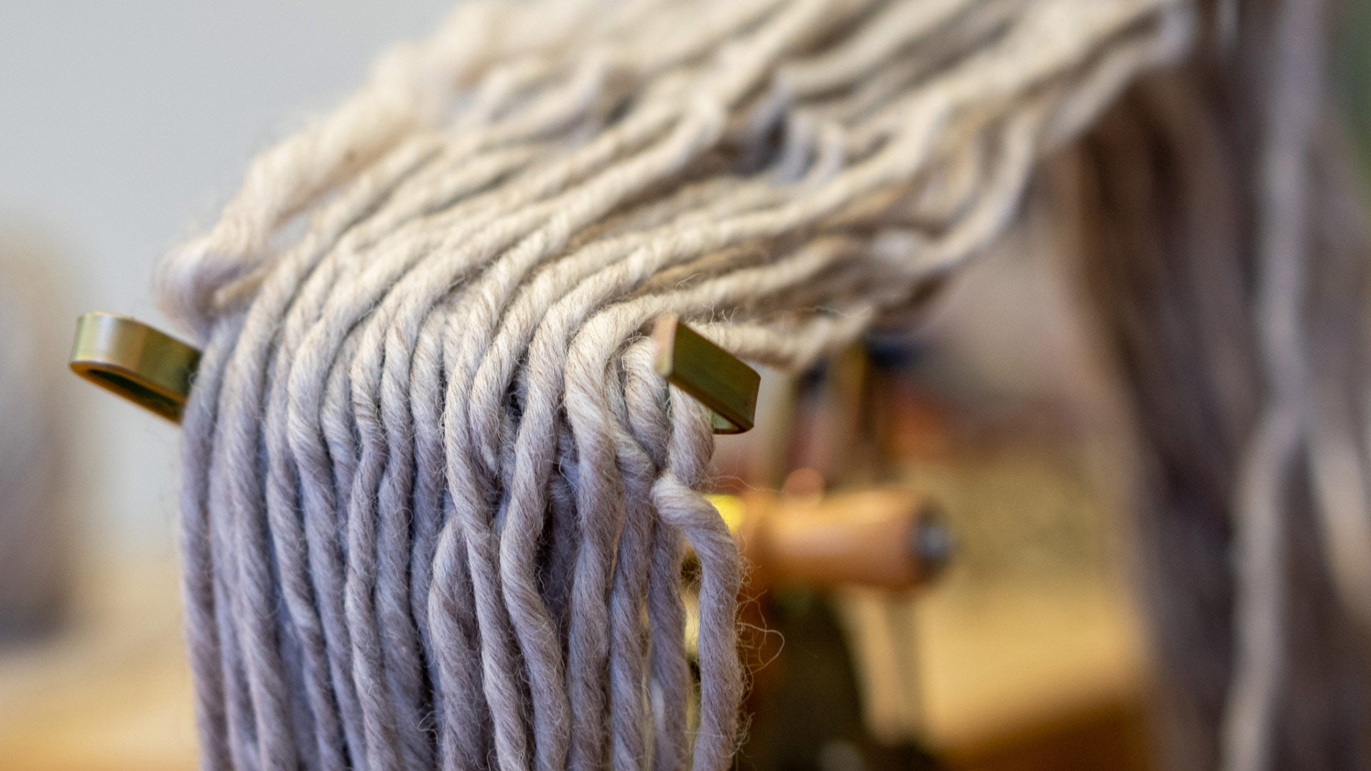 Grey wool being wound on skein