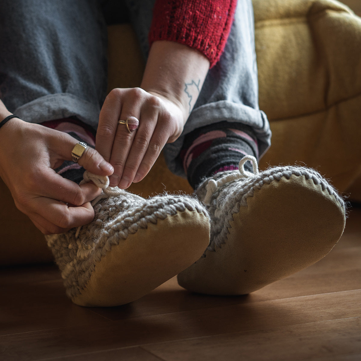 Women putting on her Padraig Slippers