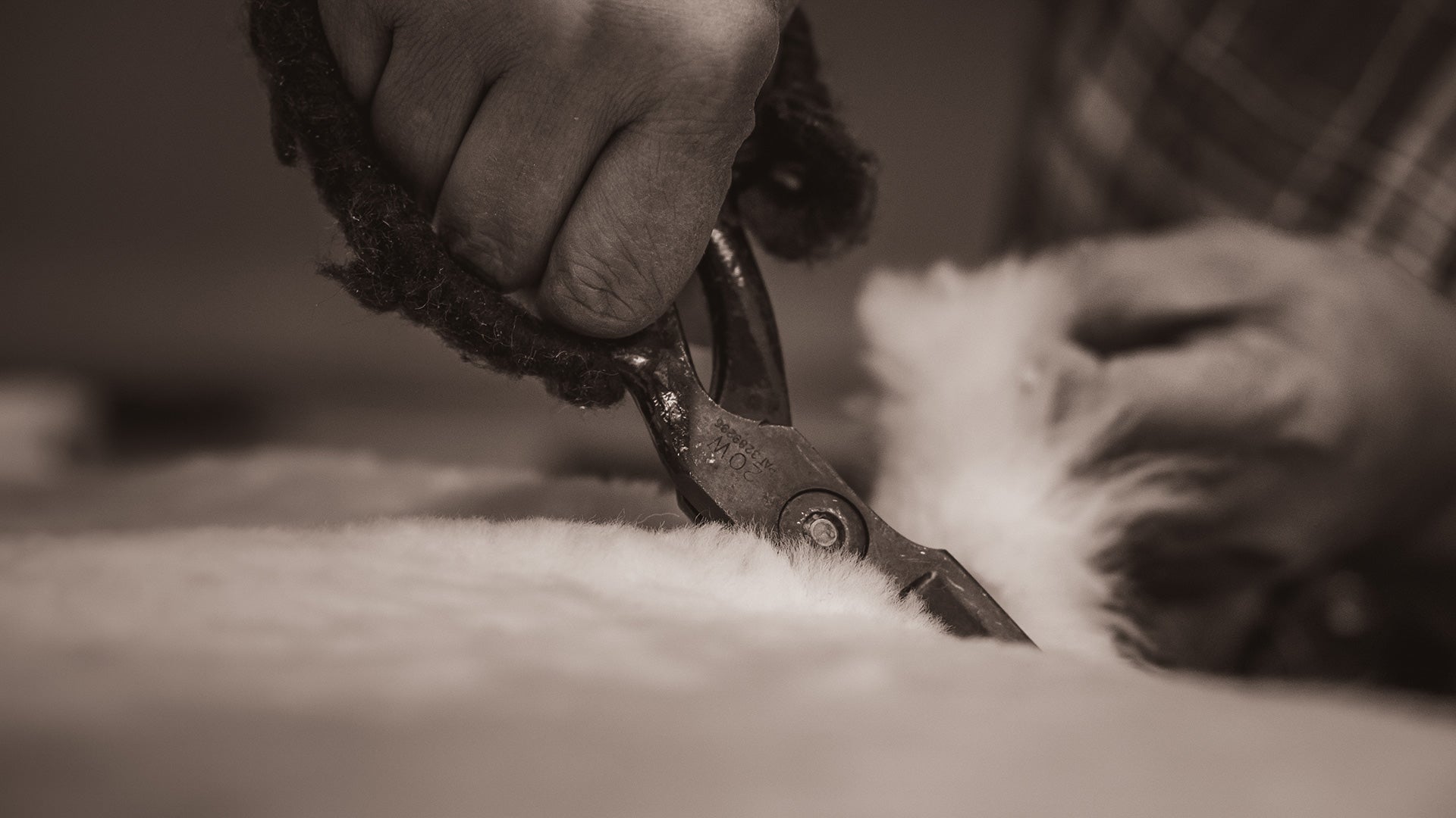 Trimming sheepskin for the liner of Padraig slippers