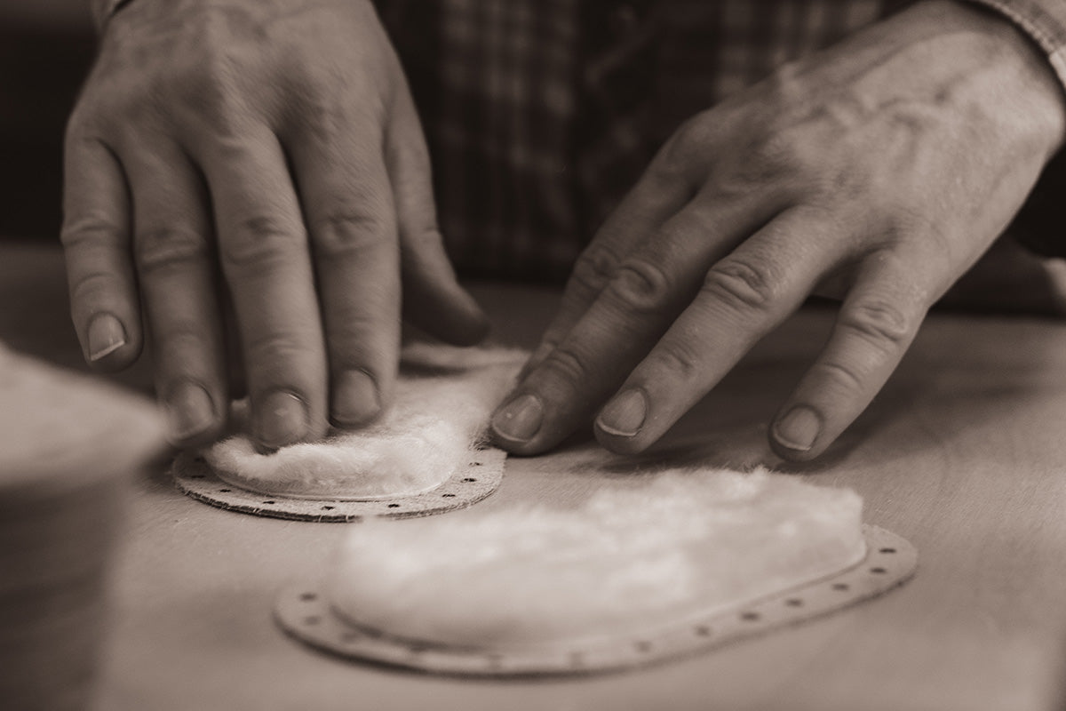 Laminating sheepskin footbed to cowhide sole of Padraig slipper