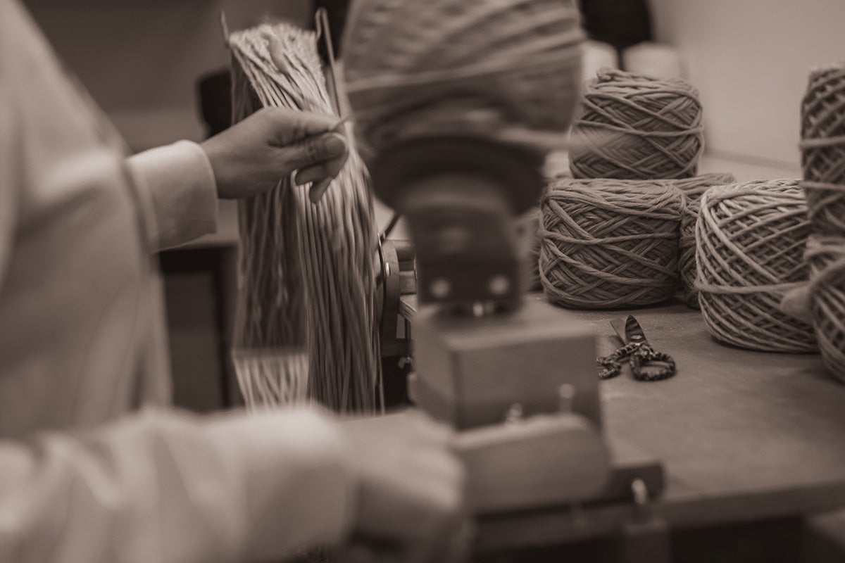 Winding skeins of natural wool for Padraig slippers